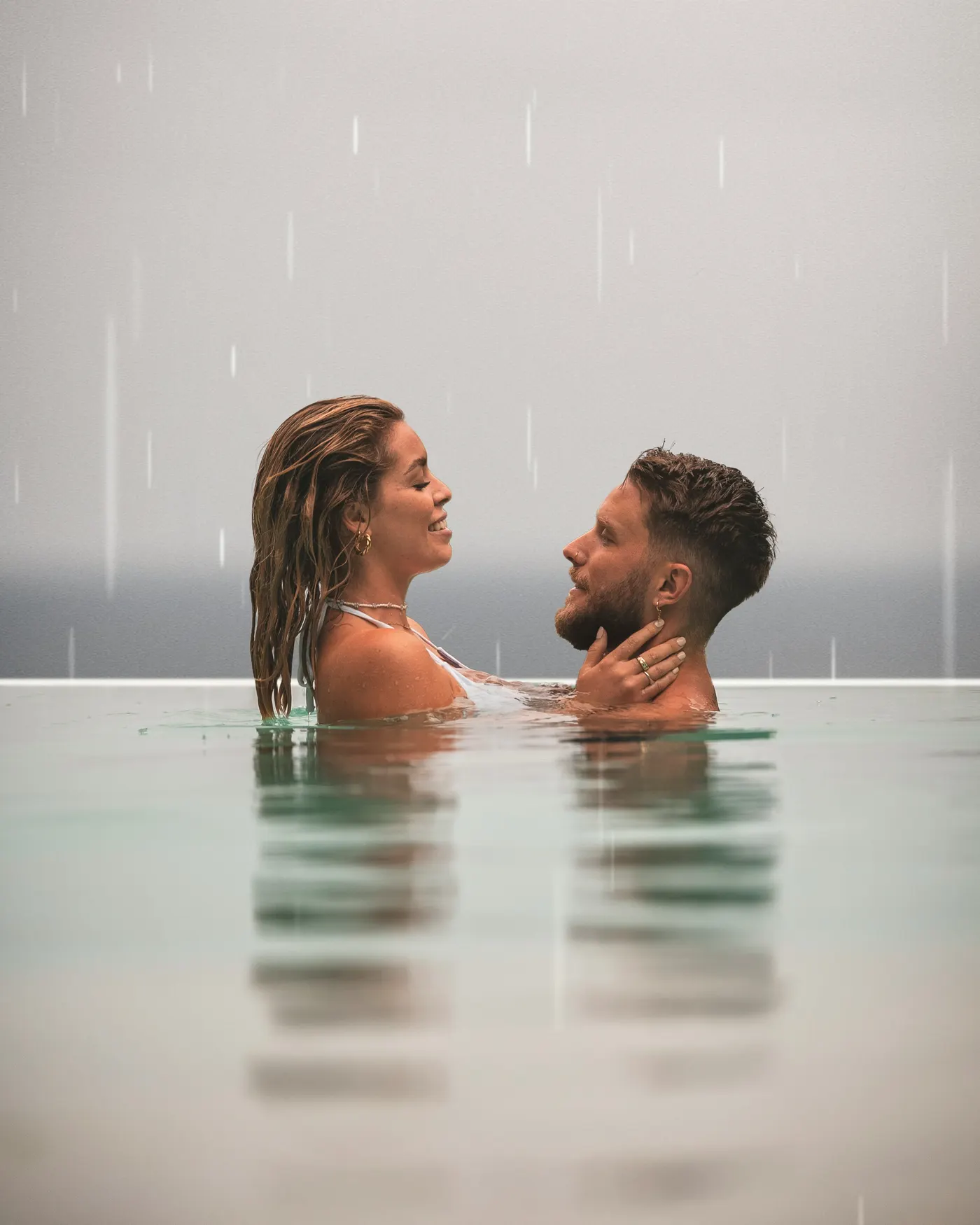 A couple together in the plunge pool at a LUM villa, Koh Tao